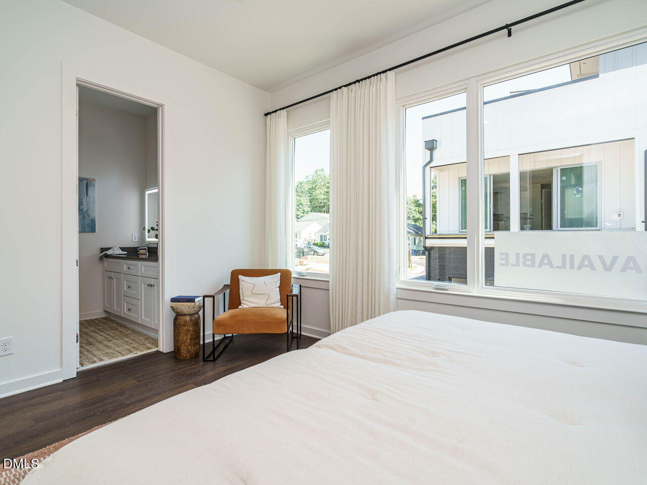 1527 Urban Trace Lane Raleigh, NC 27608 - Photo 16 of 37 a bedroom with furniture and large windows