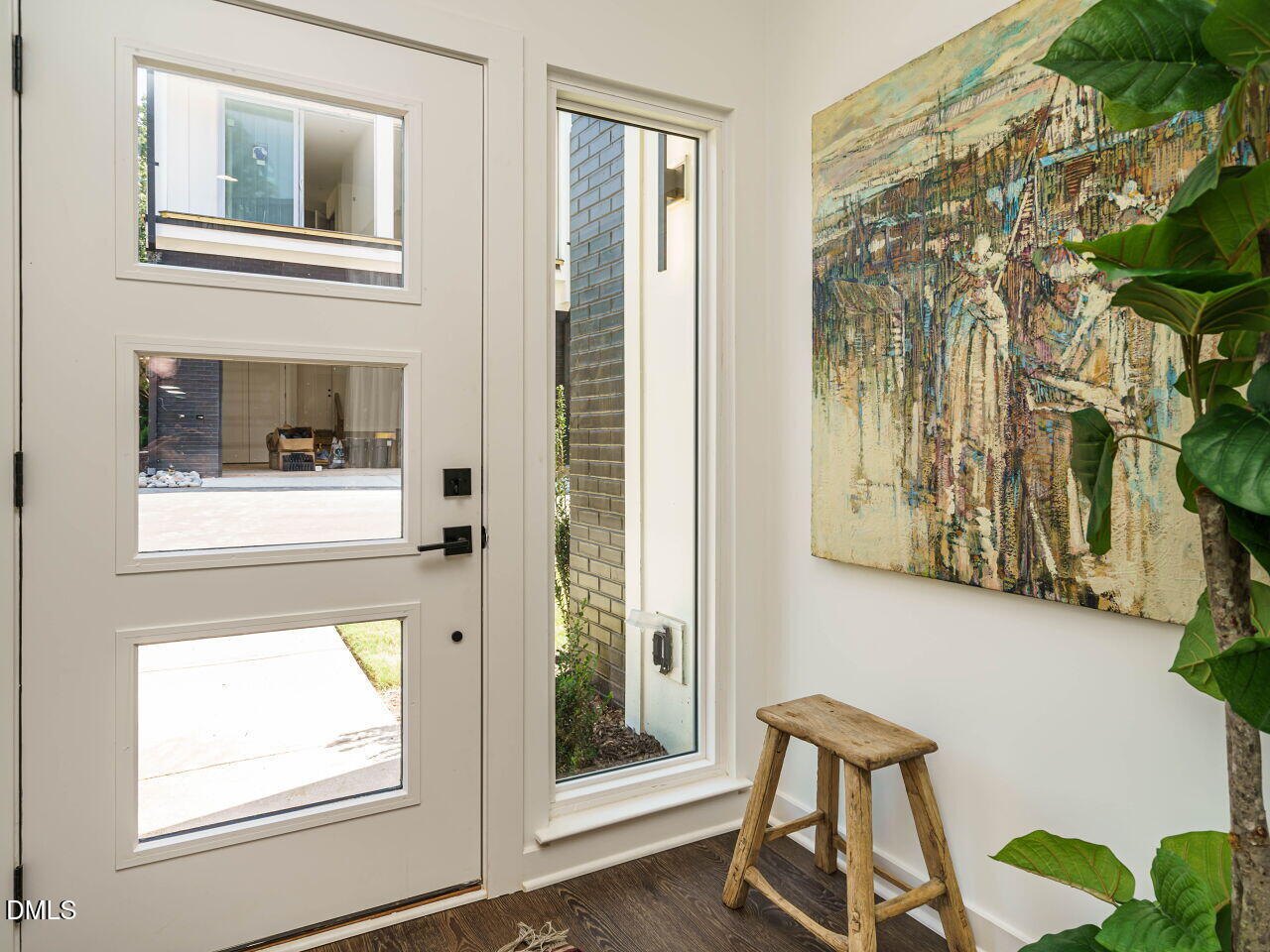 1527 Urban Trace Lane Raleigh, NC 27608 - Photo 3 of 37 a view of a door and chair in the balcony