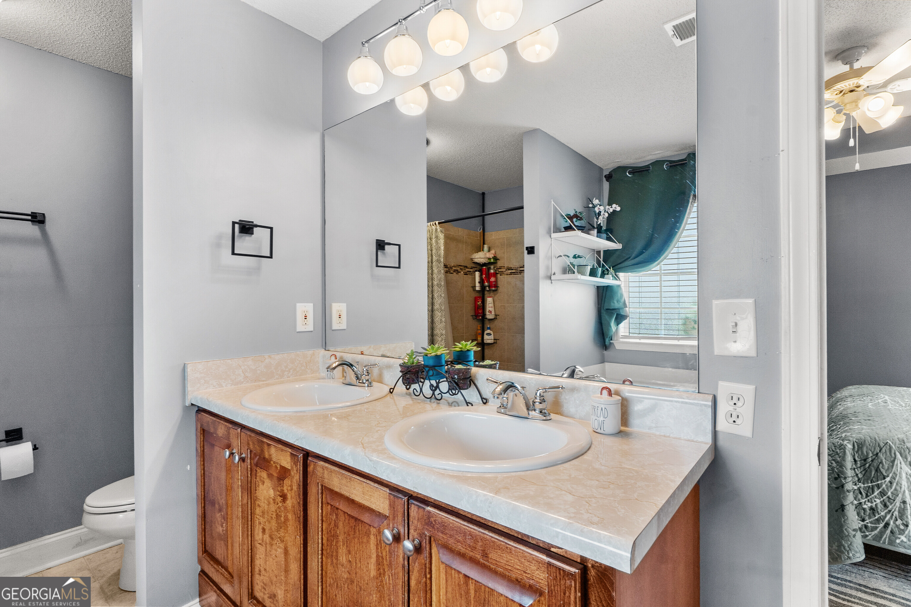 418 Covington Cove Byron, GA 31008 - Photo 32 of 47 a bathroom with a sink double vanity and a toilet