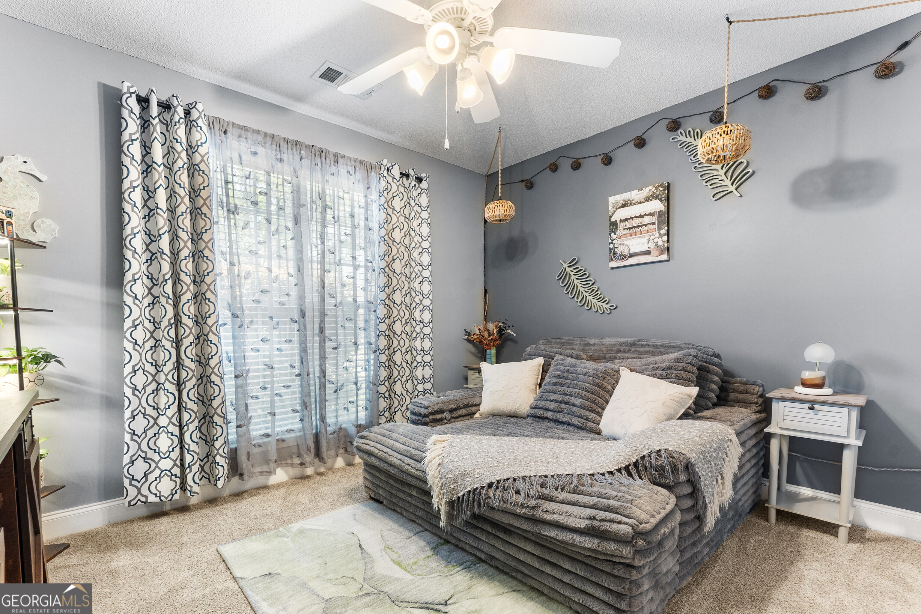 418 Covington Cove Byron, GA 31008 - Photo 38 of 47 a bedroom with a bed and a chandelier