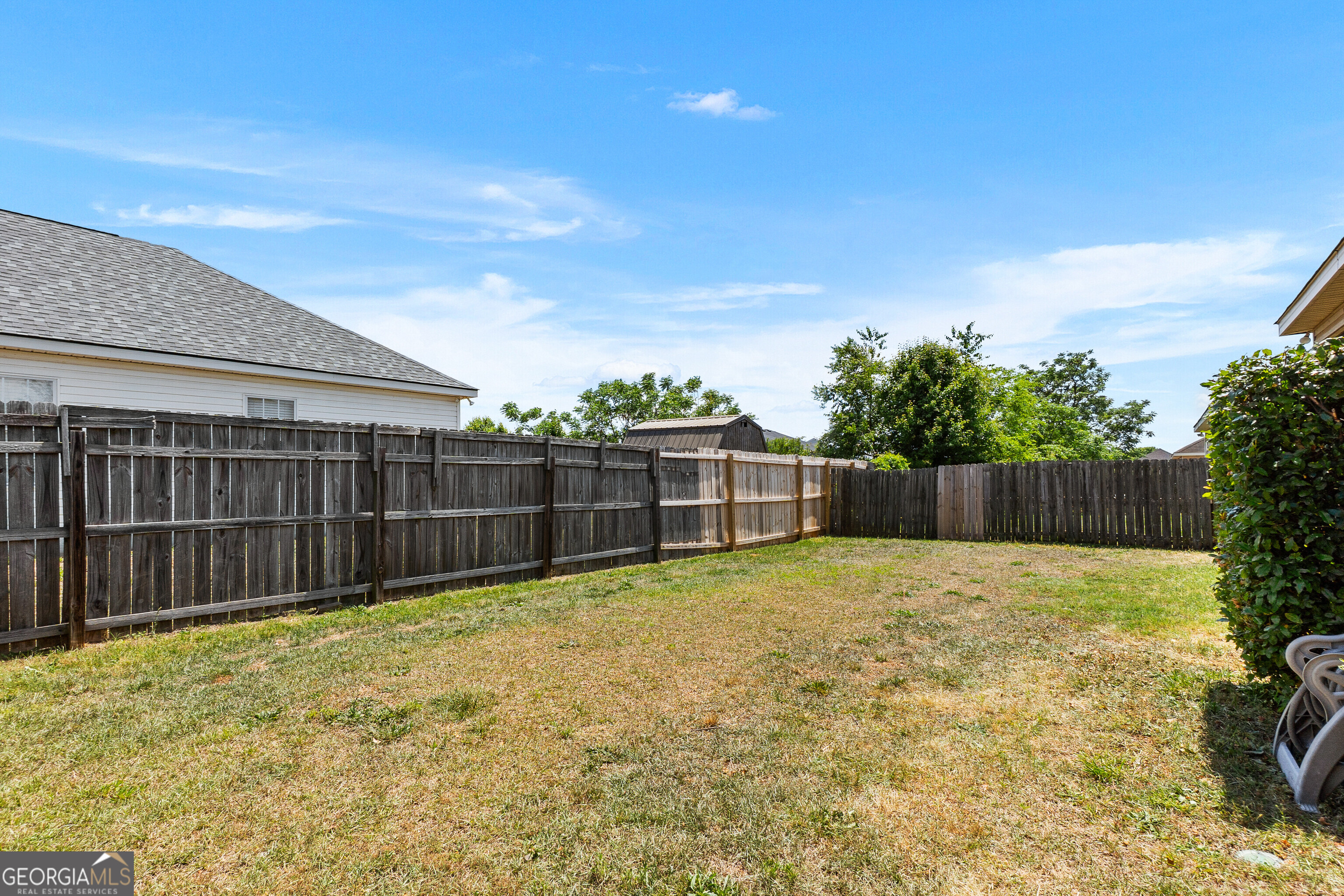 418 Covington Cove Byron, GA 31008 - Photo 47 of 47 a view of a backyard with a fence
