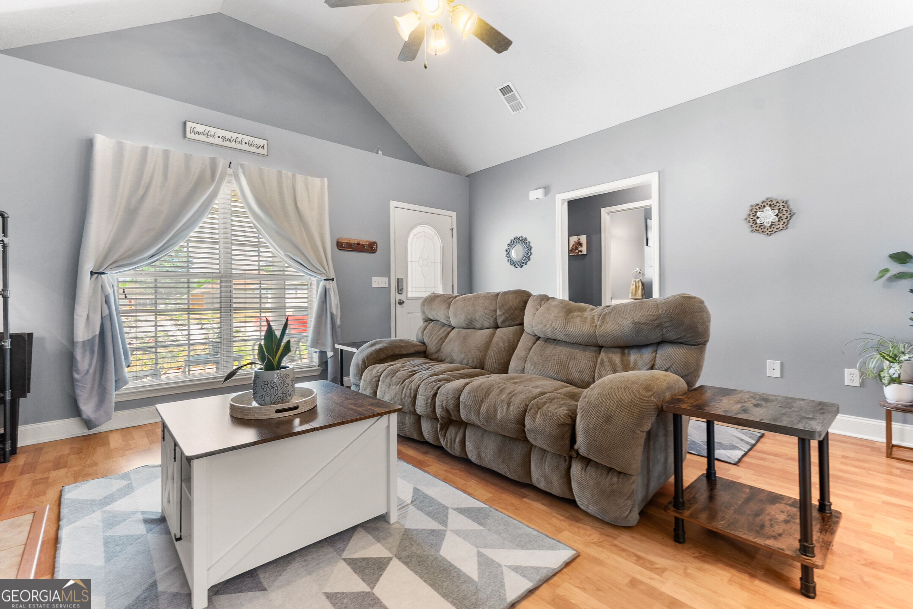 418 Covington Cove Byron, GA 31008 - Photo 7 of 47 a living room with furniture and a large window