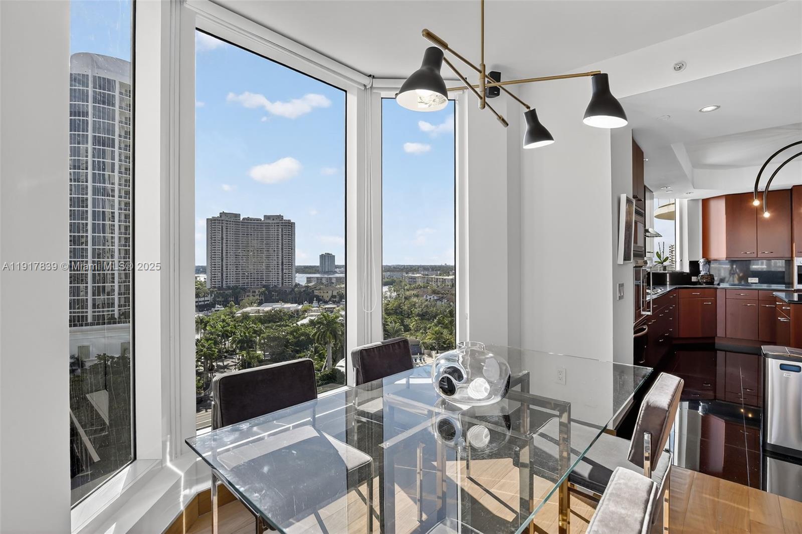 6000 Island Boulevard, Unit 1208 Aventura, FL 33160 - Photo 19 of 50 a view of a dining room with furniture window and outside view
