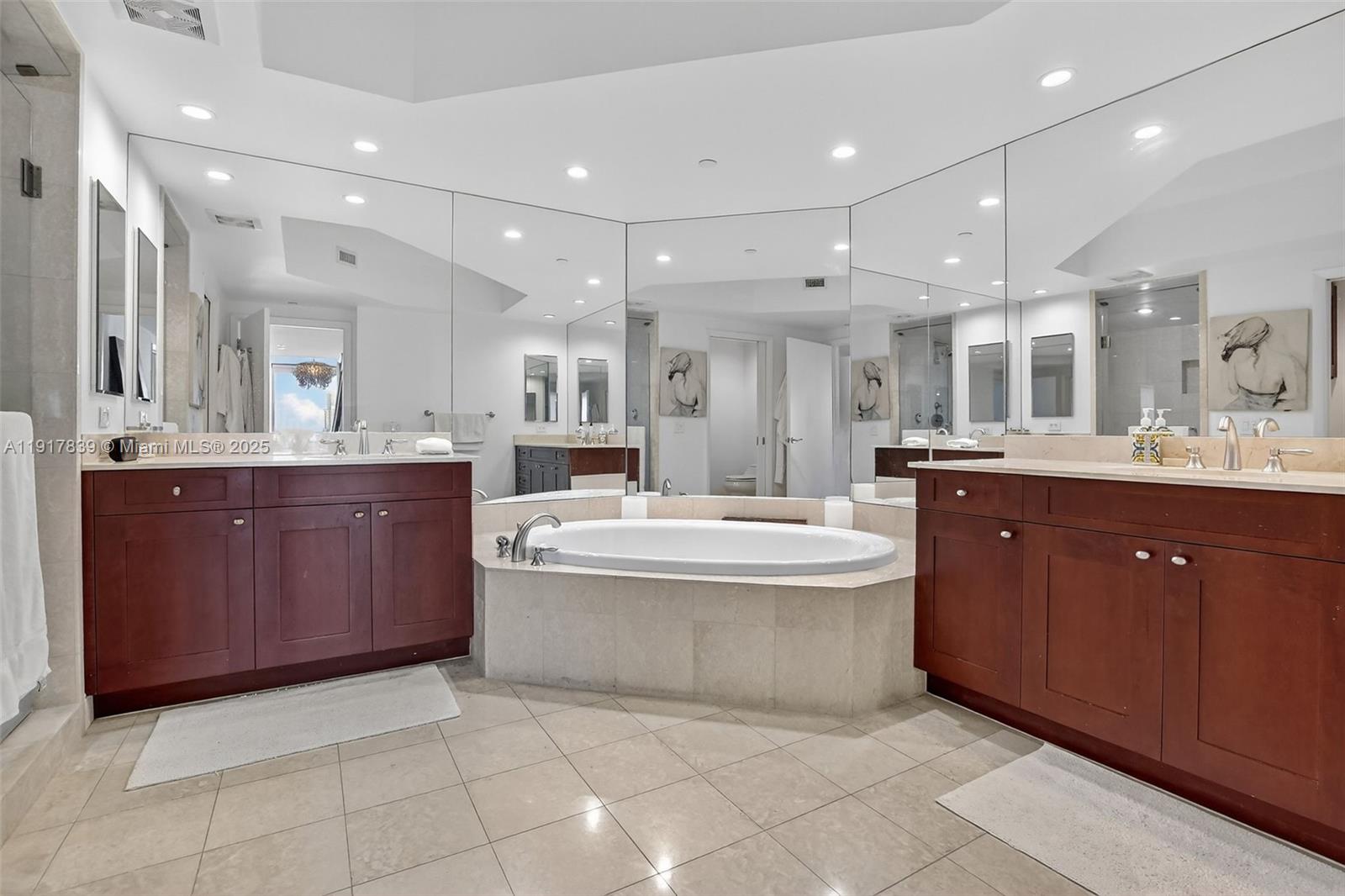 6000 Island Boulevard, Unit 1208 Aventura, FL 33160 - Photo 24 of 50 a large kitchen with a large counter top space sink and stainless steel appliances