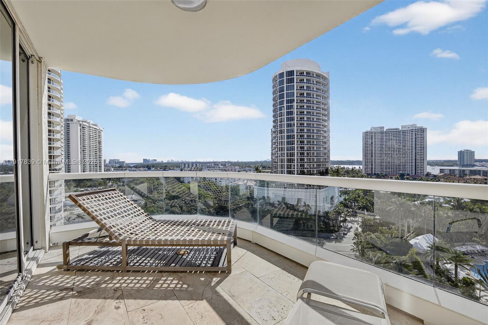 6000 Island Boulevard, Unit 1208 Aventura, FL 33160 - Photo 48 of 50 a view of balcony with a potted plant and outdoor seating