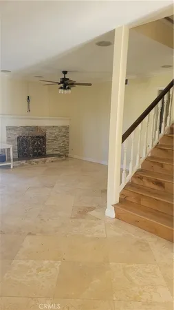 a view of a livingroom with a staircase