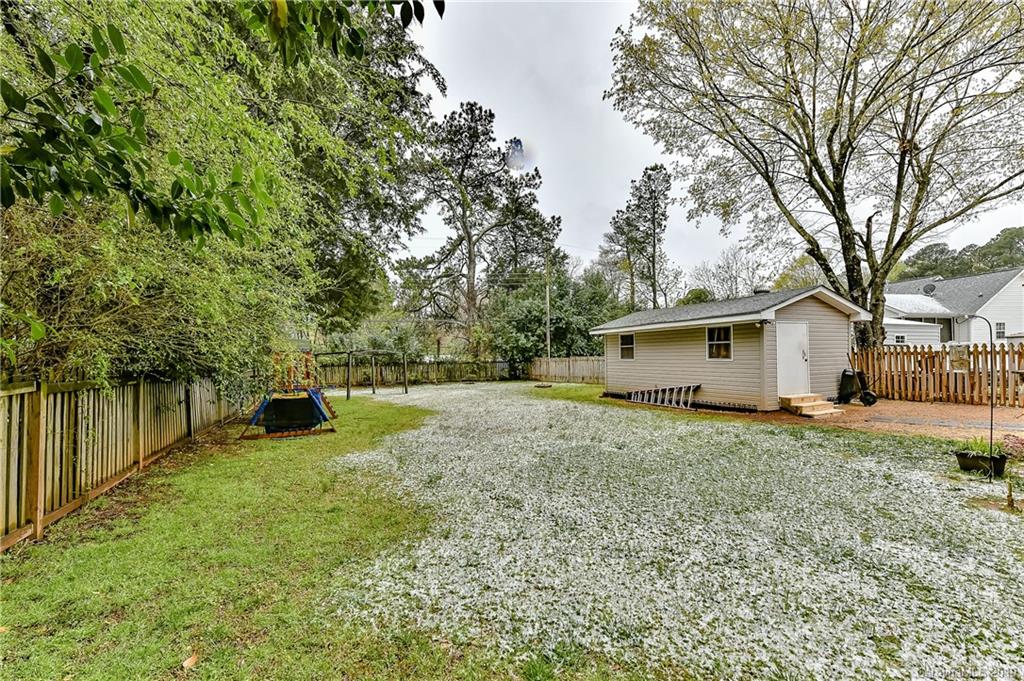 1108 Pinewood Road Rock Hill, SC 29730 - Photo 24 of 26 a view of a house with backyard and trees