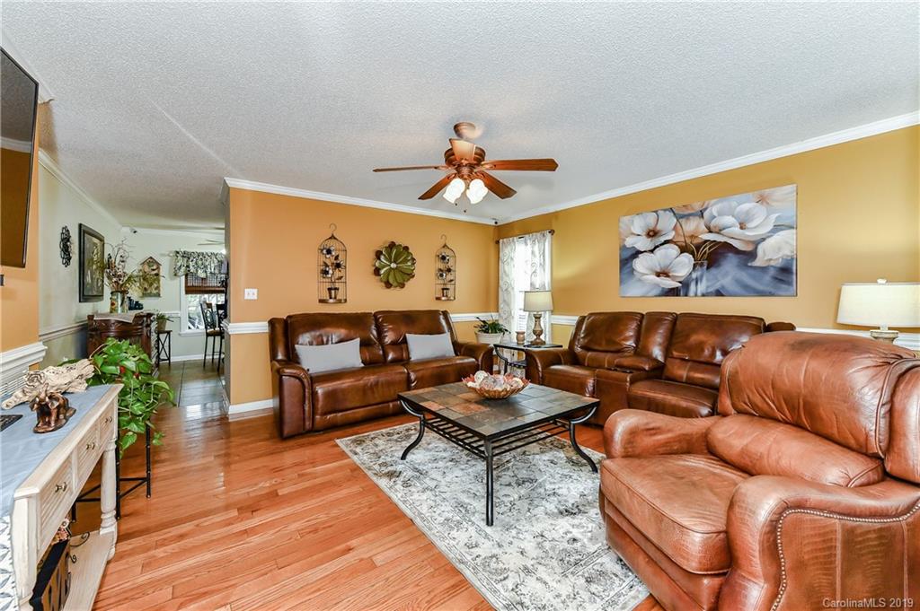 1108 Pinewood Road Rock Hill, SC 29730 - Photo 5 of 26 a living room with furniture and a chandelier