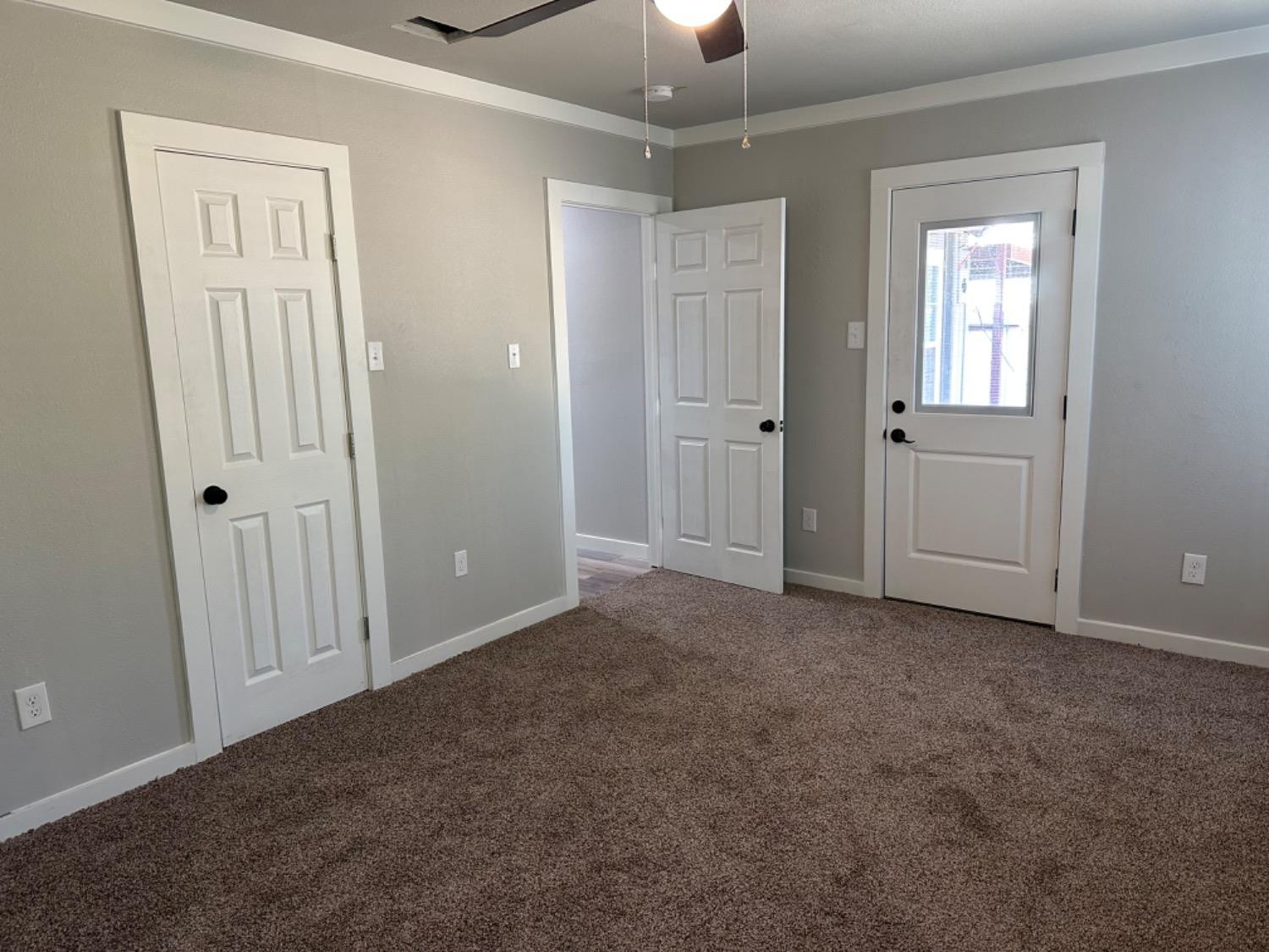 3408 29th Street Lubbock, TX 79410 - Photo 15 of 19 an empty room with windows and closet