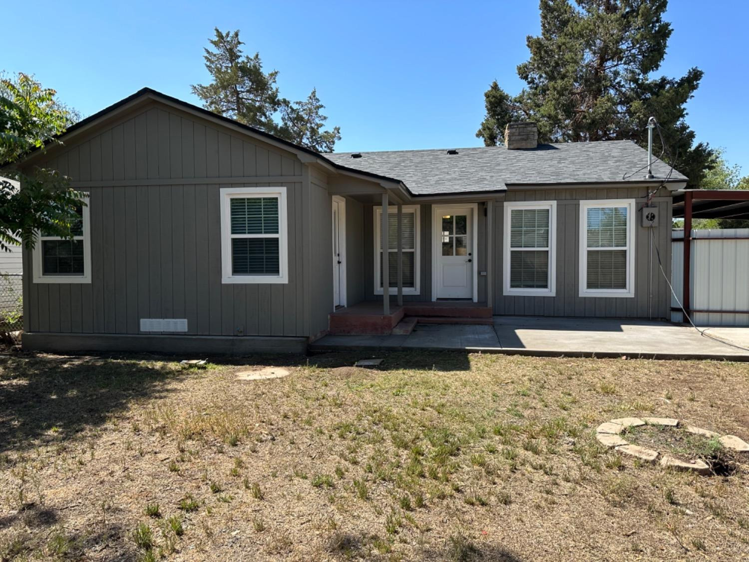 3408 29th Street Lubbock, TX 79410 - Photo 18 of 19 a front view of a house with a yard
