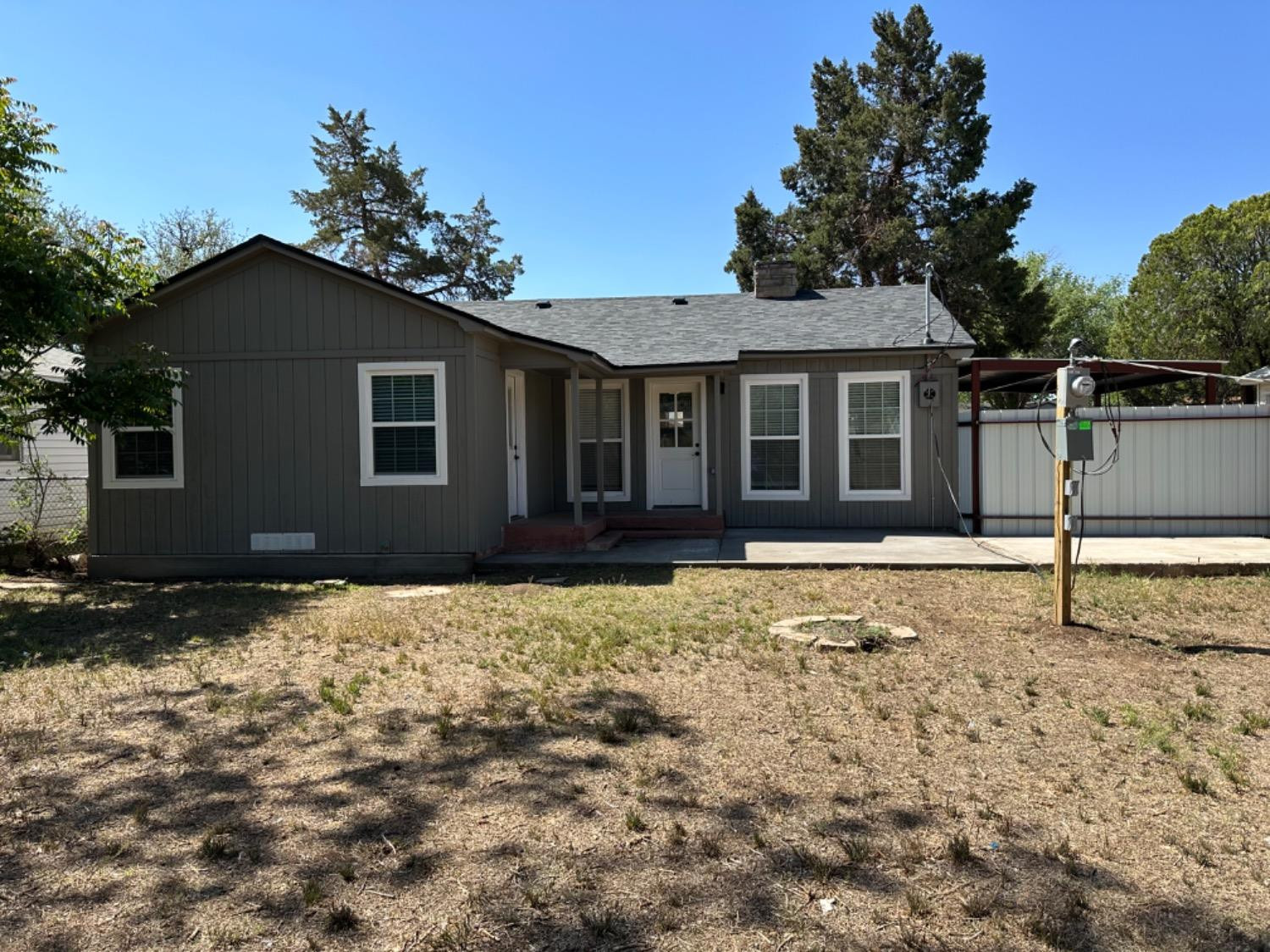 3408 29th Street Lubbock, TX 79410 - Photo 19 of 19 a house with trees in the background