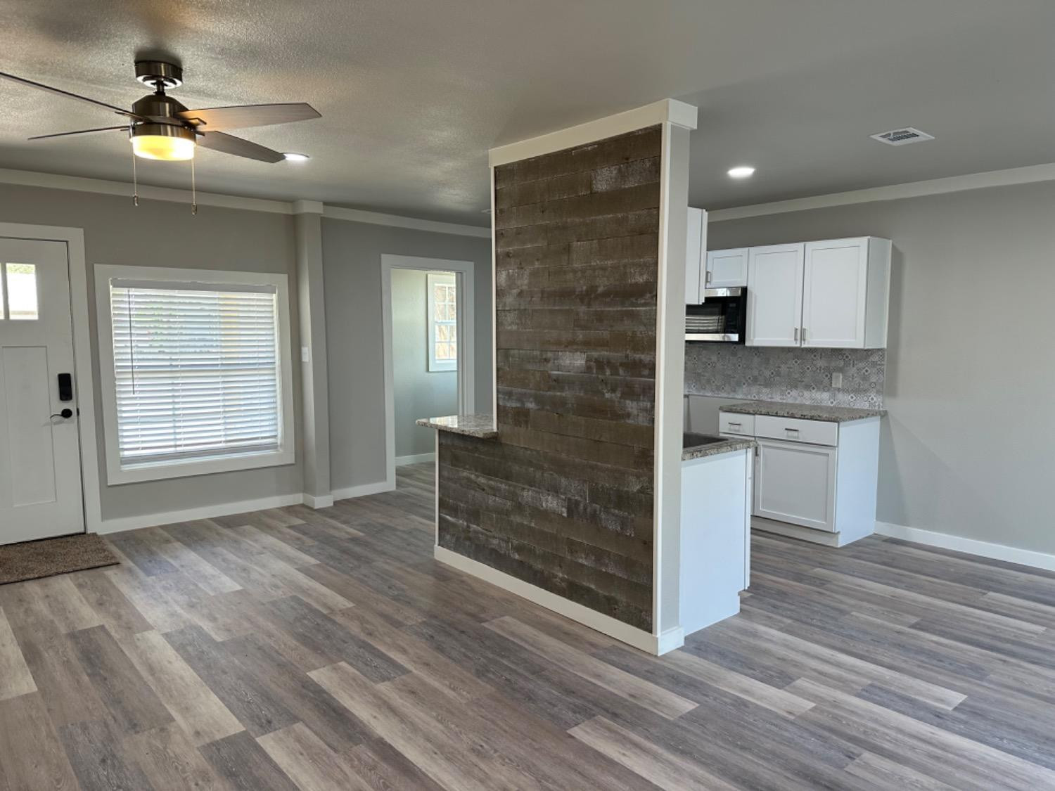 3408 29th Street Lubbock, TX 79410 - Photo 5 of 19 a view of kitchen with sink and wooden floor