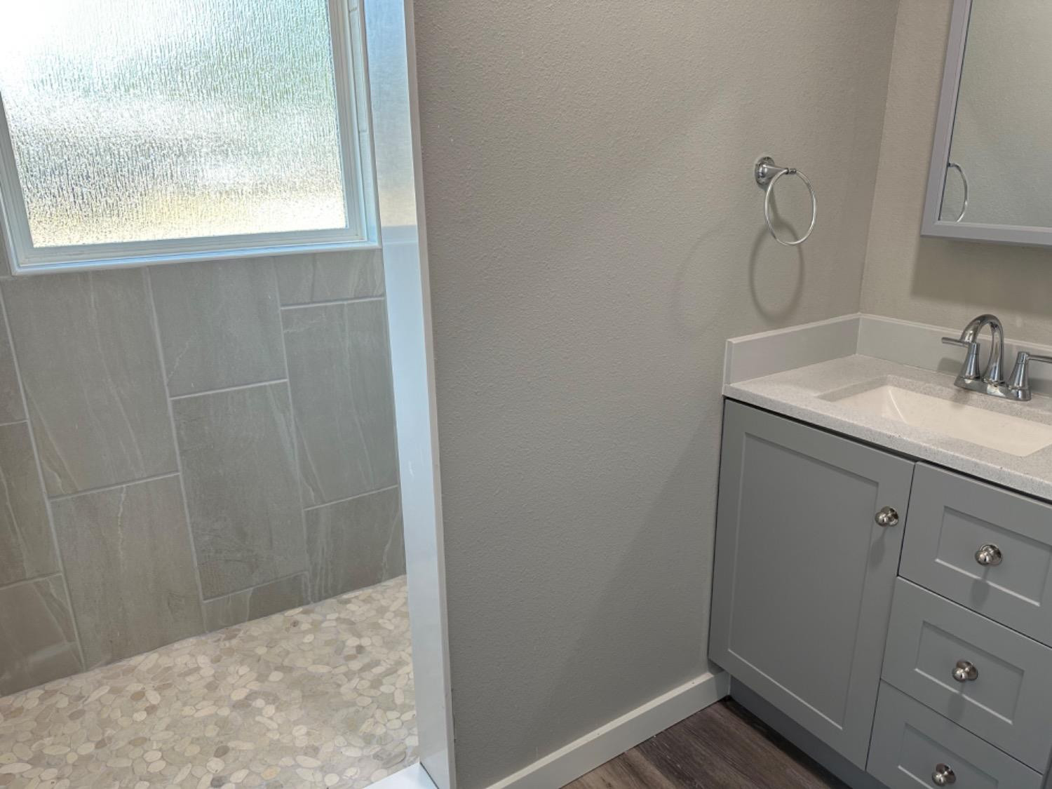 3408 29th Street Lubbock, TX 79410 - Photo 9 of 19 a bathroom with a sink and vanity