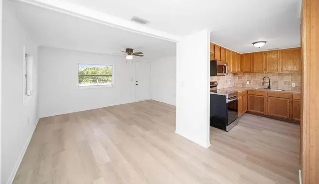 a view of kitchen with wooden floor
