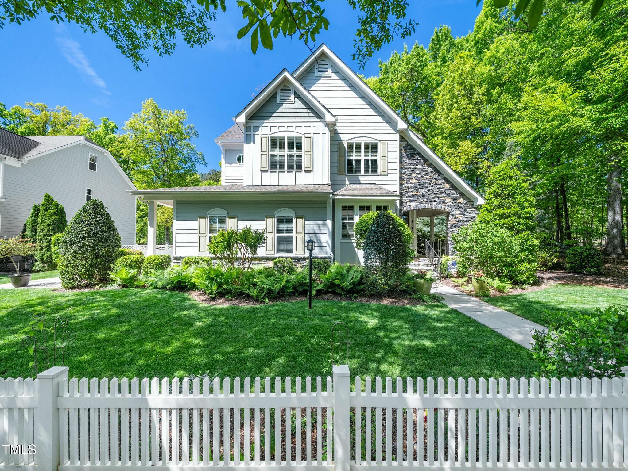 4210 Falls River Avenue Raleigh, NC 27614 - Photo 1 of 53 a front view of a house with a yard