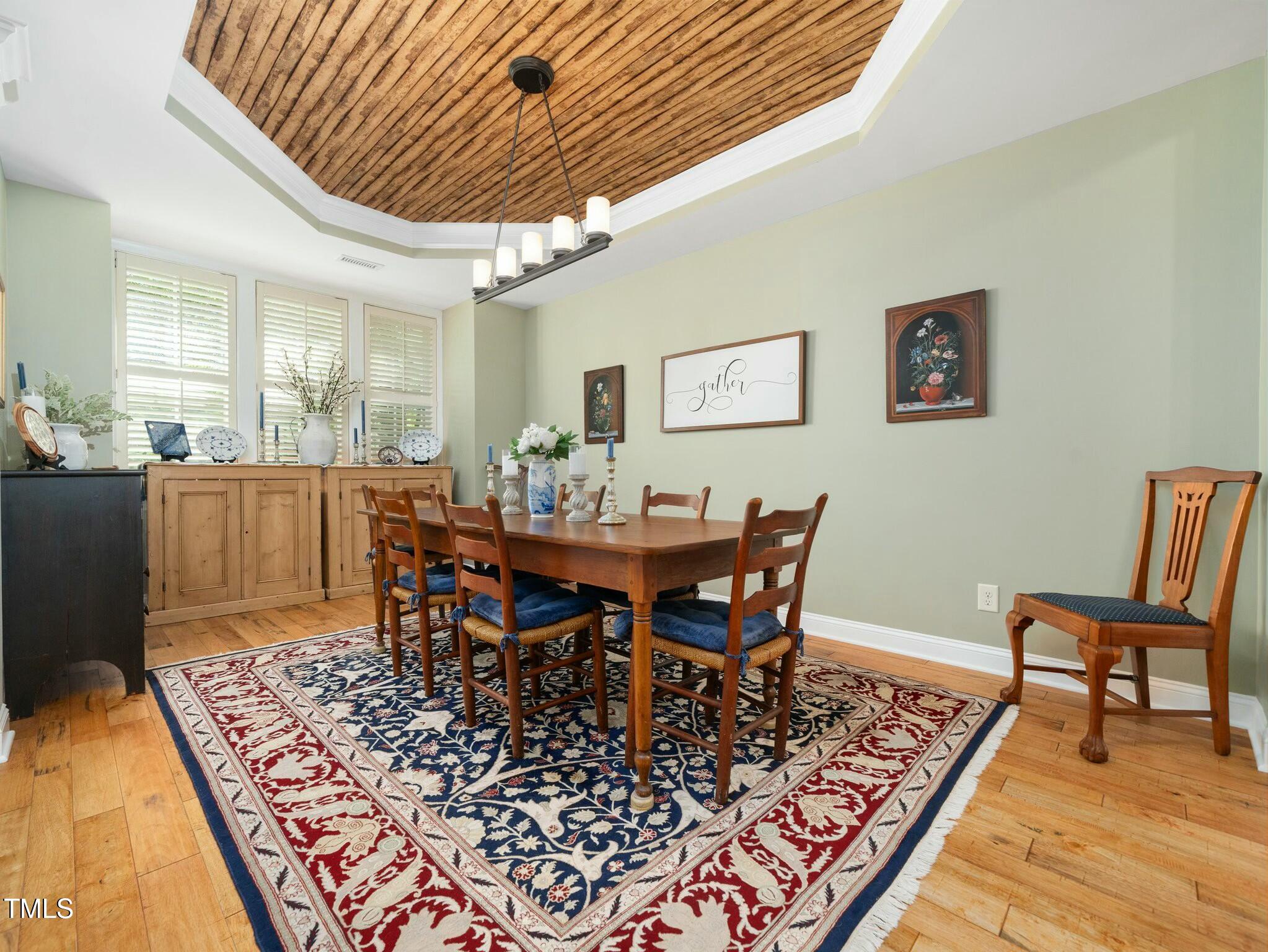 4210 Falls River Avenue Raleigh, NC 27614 - Photo 13 of 53 a view of a dining room with furniture