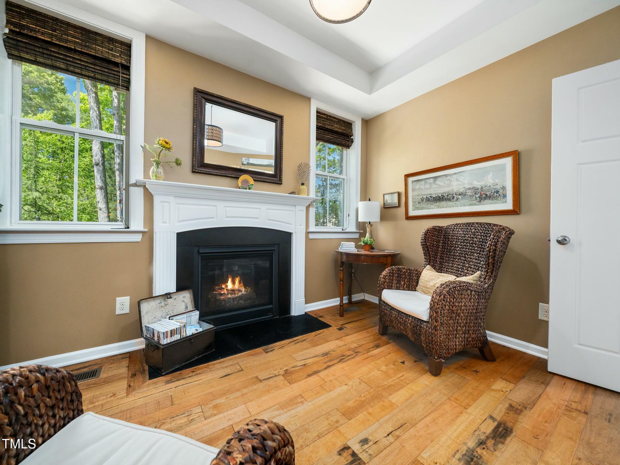 4210 Falls River Avenue Raleigh, NC 27614 - Photo 23 of 53 a living room with furniture and a fireplace