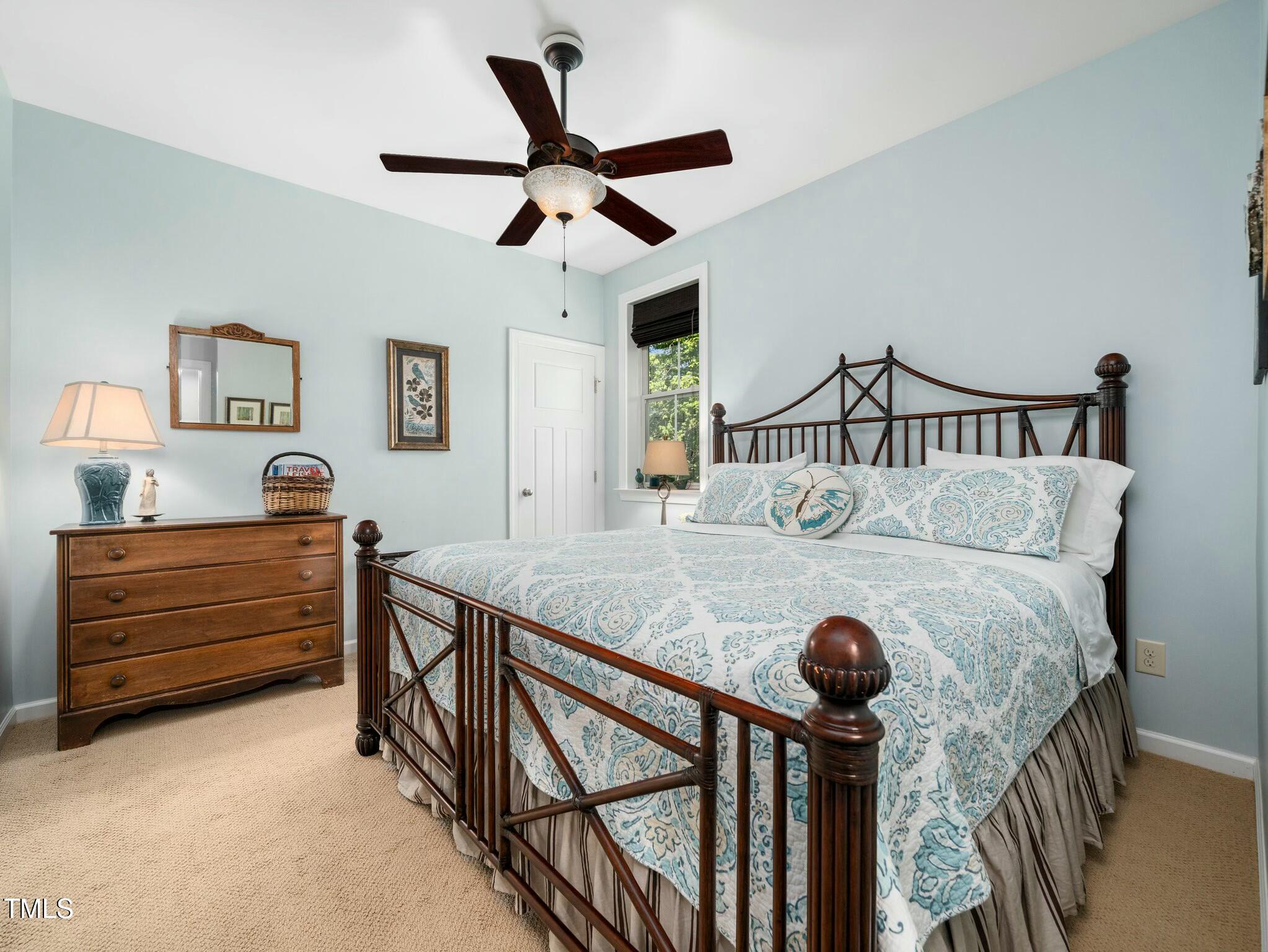 4210 Falls River Avenue Raleigh, NC 27614 - Photo 28 of 53 a bed room with furniture and a window