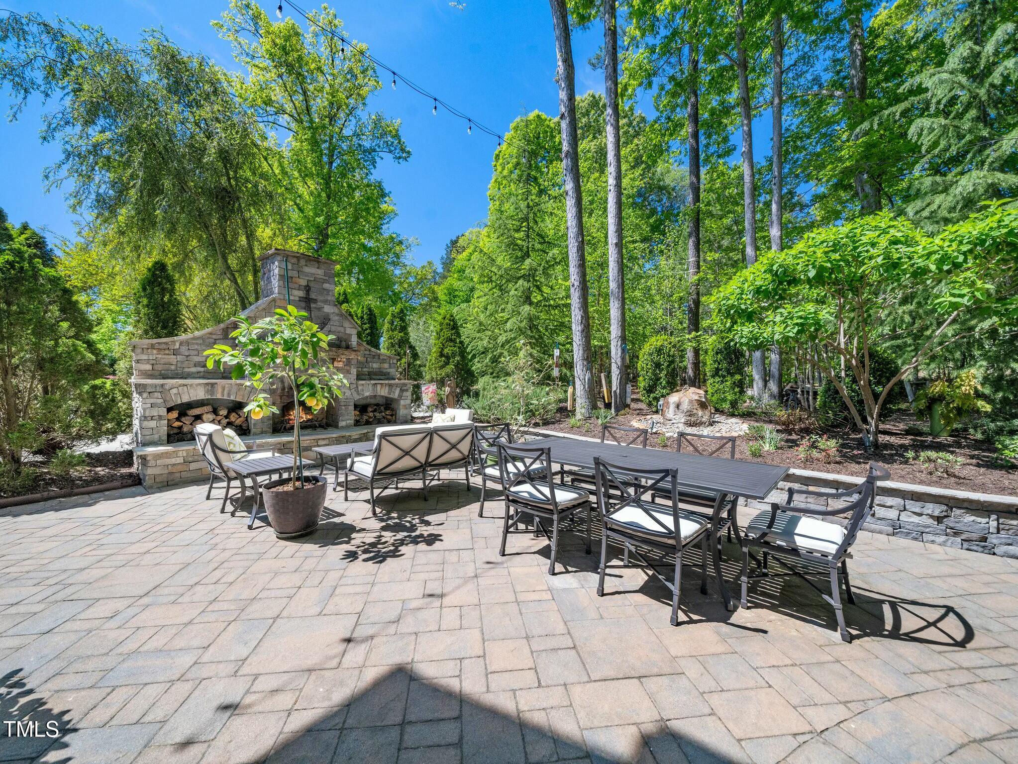 4210 Falls River Avenue Raleigh, NC 27614 - Photo 37 of 53 a view of backyard with outdoor seating and plants