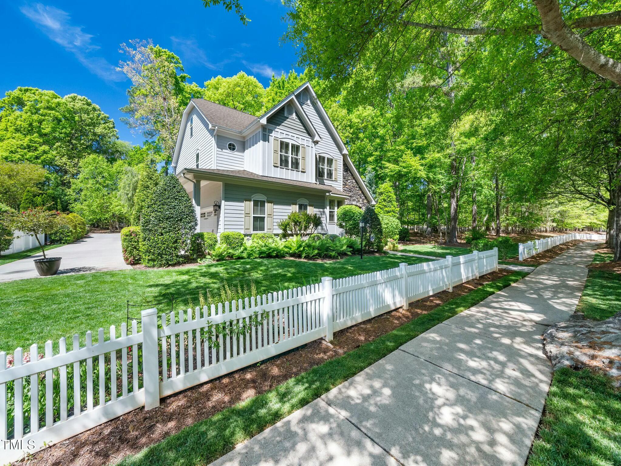 4210 Falls River Avenue Raleigh, NC 27614 - Photo 42 of 53 a front view of house with yard and green space