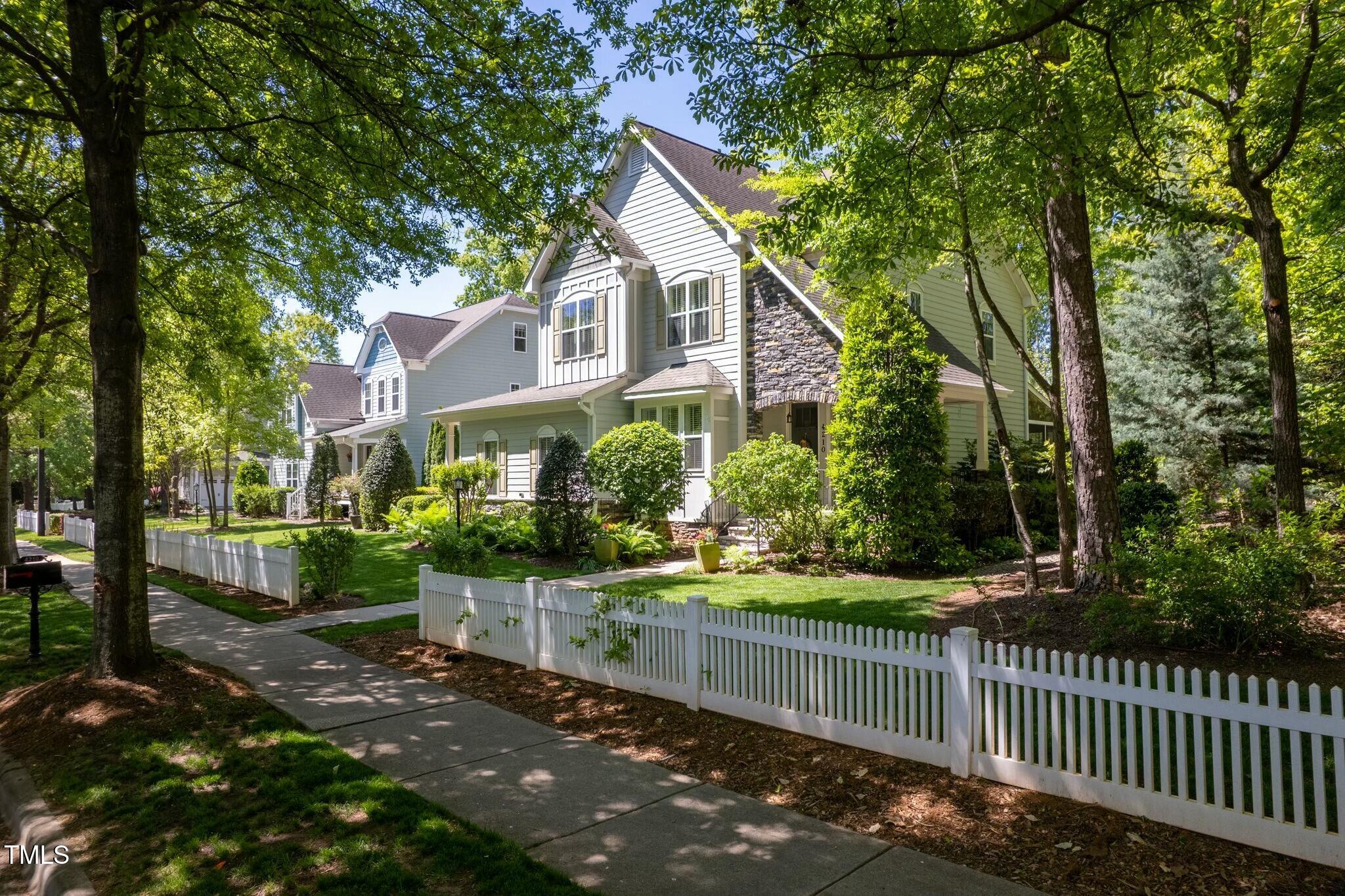 4210 Falls River Avenue Raleigh, NC 27614 - Photo 43 of 53 a front view of a house with a yard