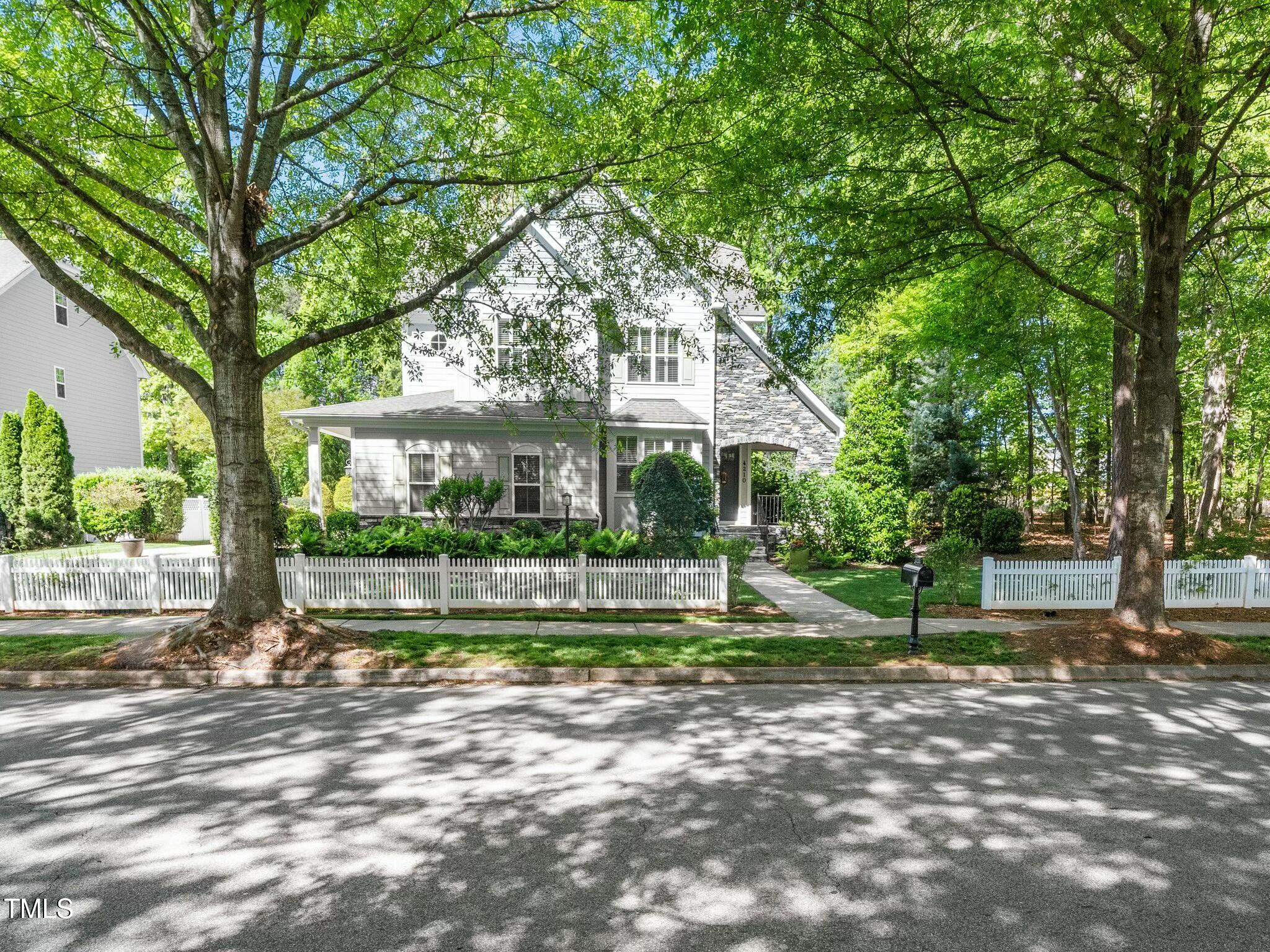 4210 Falls River Avenue Raleigh, NC 27614 - Photo 44 of 53 a front view of a house with a yard