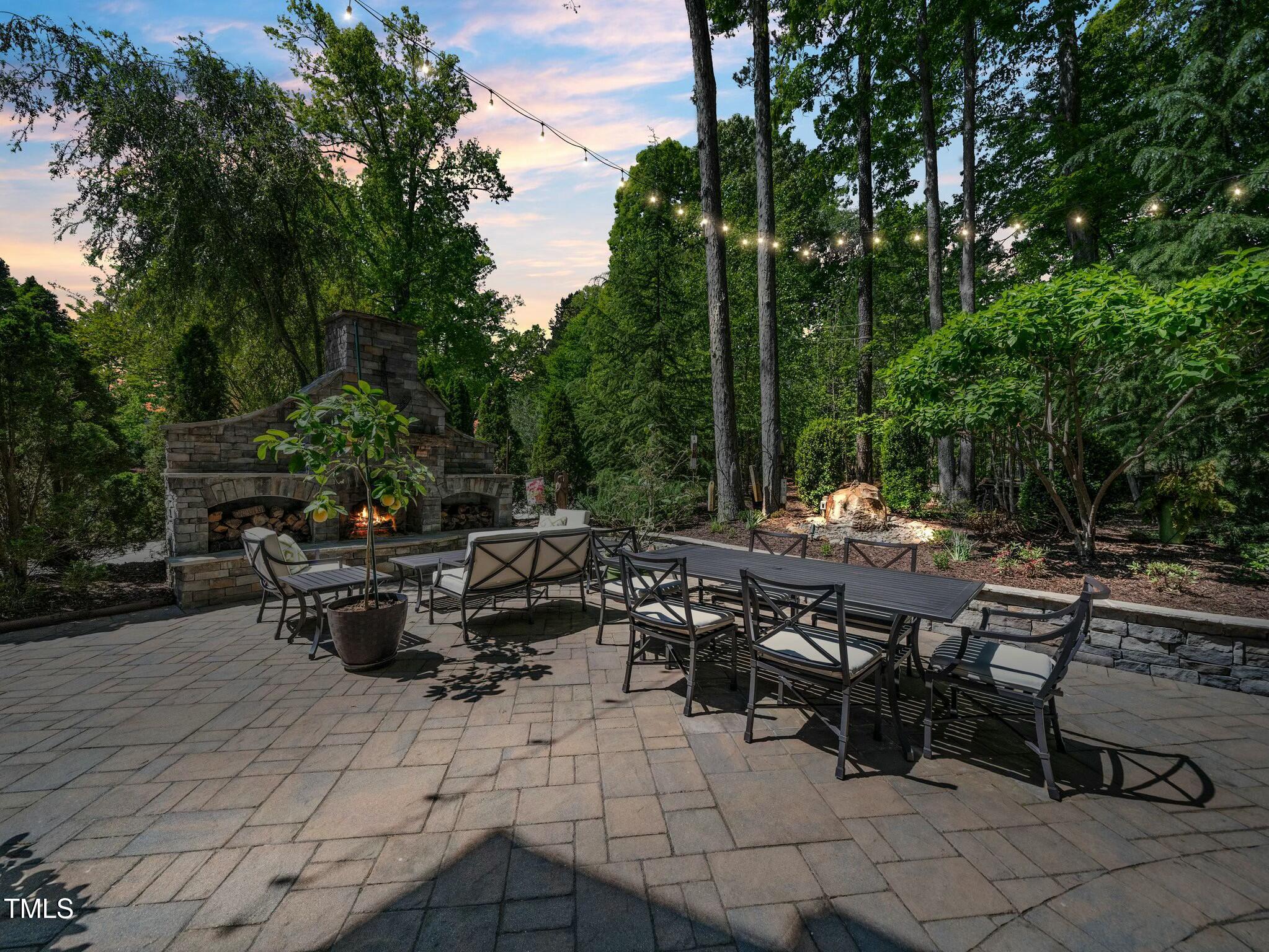 4210 Falls River Avenue Raleigh, NC 27614 - Photo 48 of 53 a view of backyard with outdoor seating a patio and plants