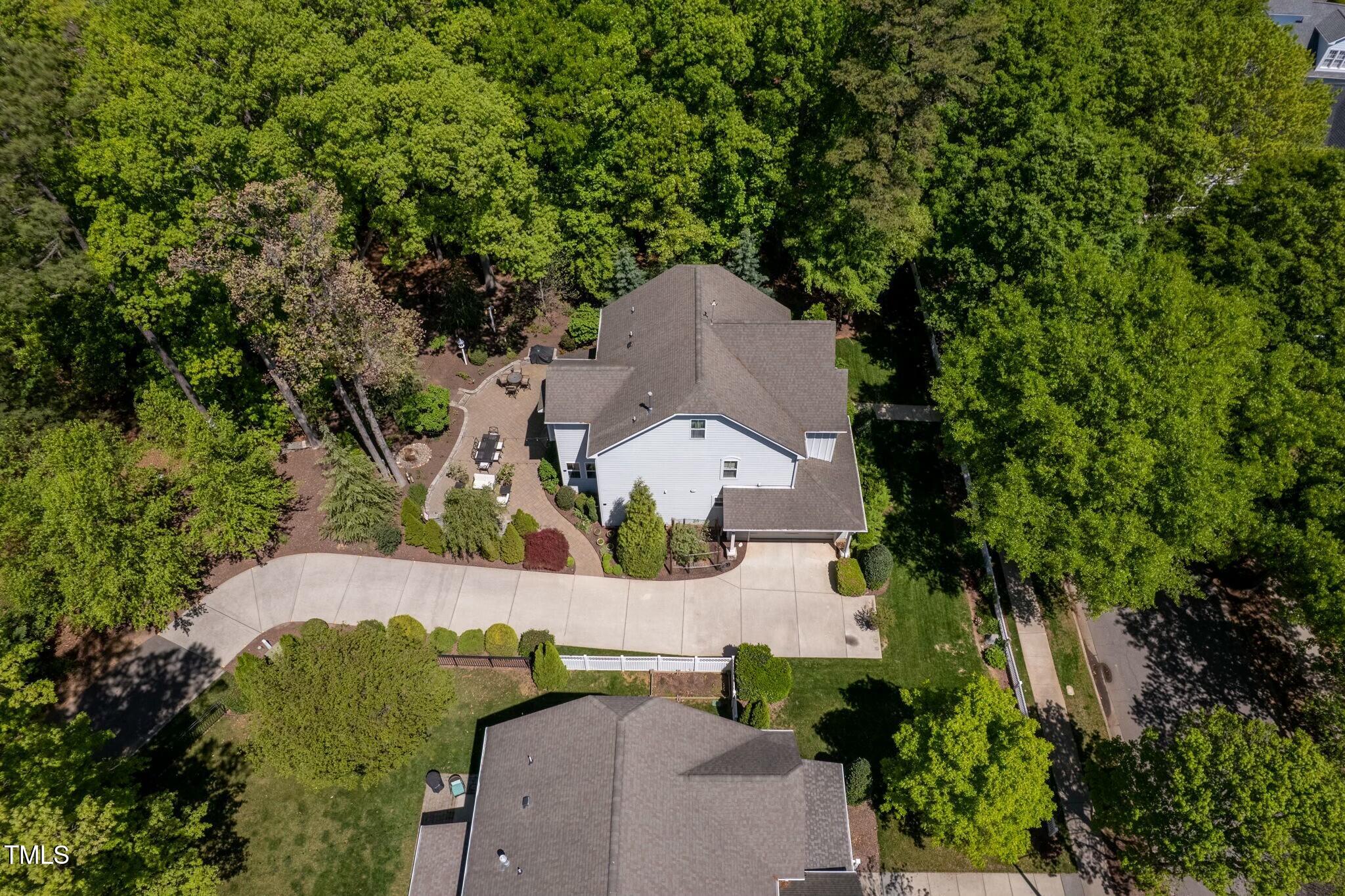 4210 Falls River Avenue Raleigh, NC 27614 - Photo 52 of 53 an aerial view of a house with a yard and trees