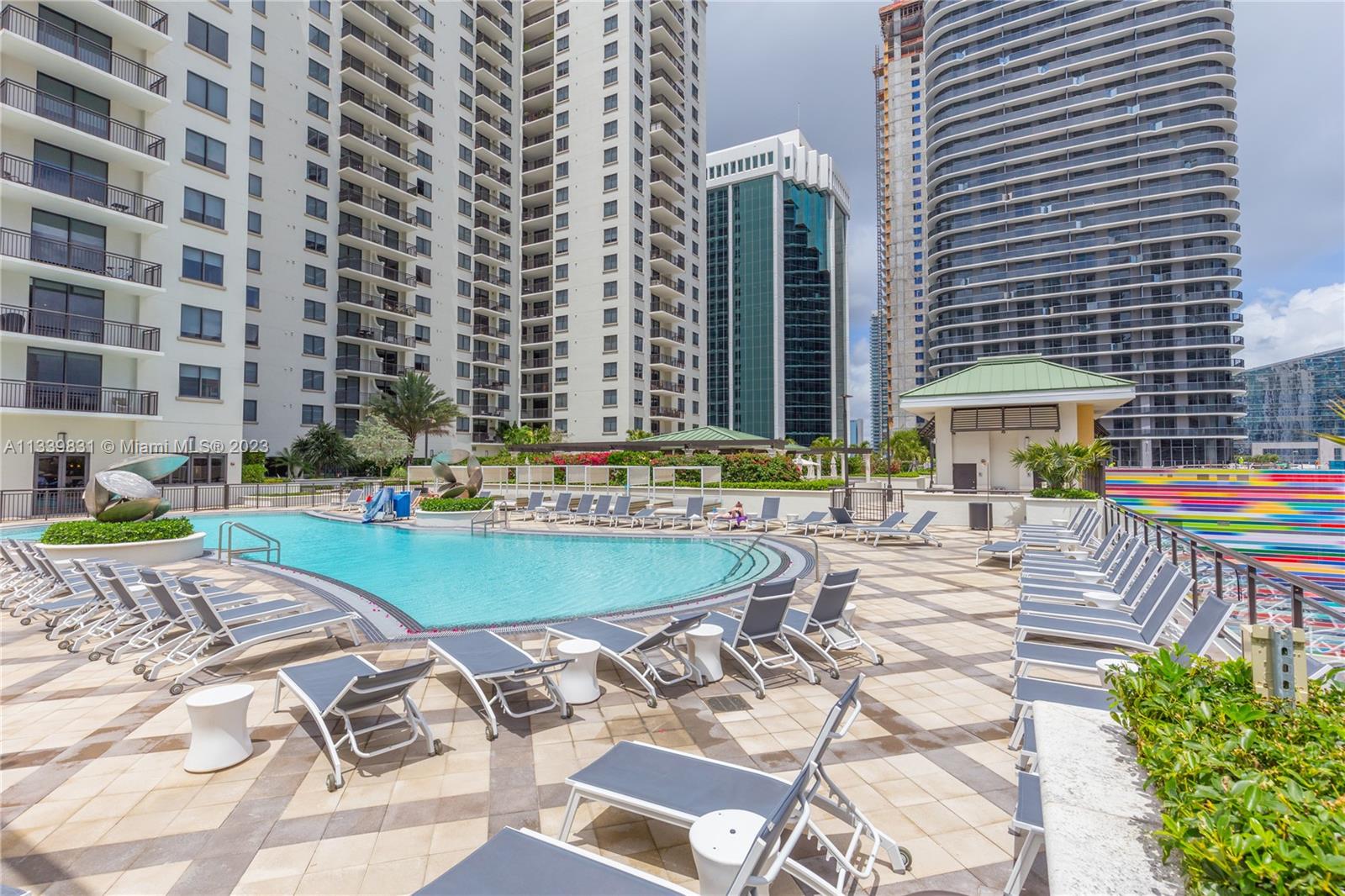 999 Southwest 1st Avenue, Unit 1811 Miami, FL 33130 - Photo 20 of 36 a view of a swimming pool with a patio