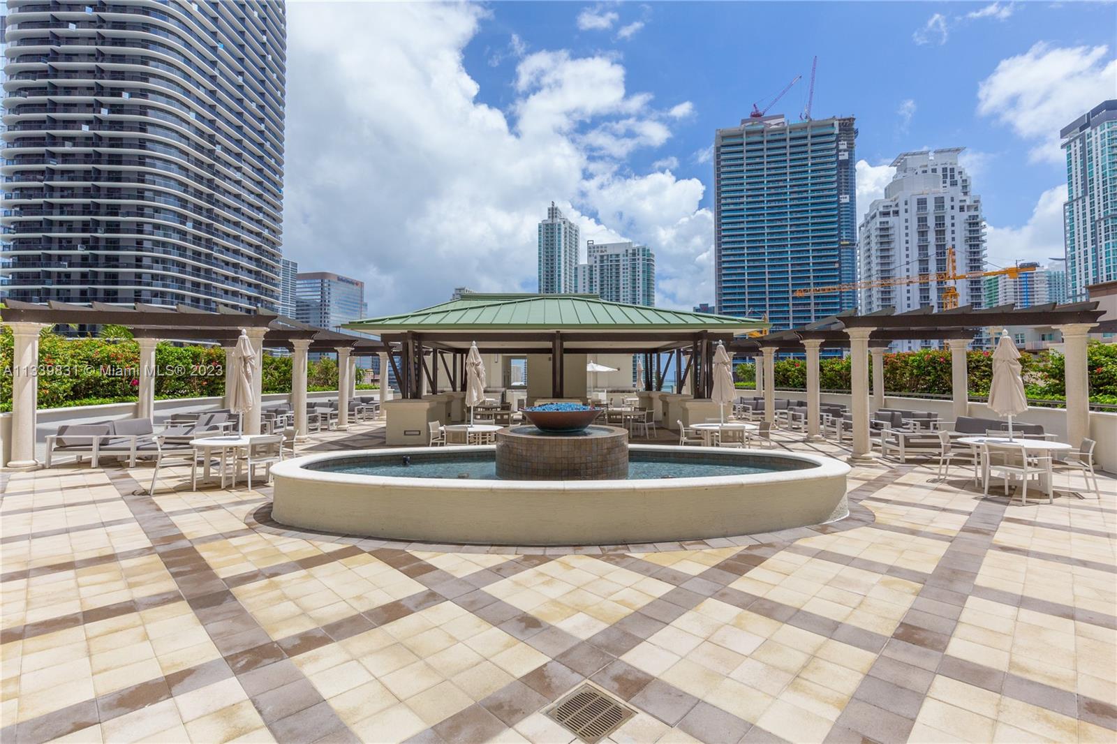 999 Southwest 1st Avenue, Unit 1811 Miami, FL 33130 - Photo 22 of 36 a front view of a building with a yard