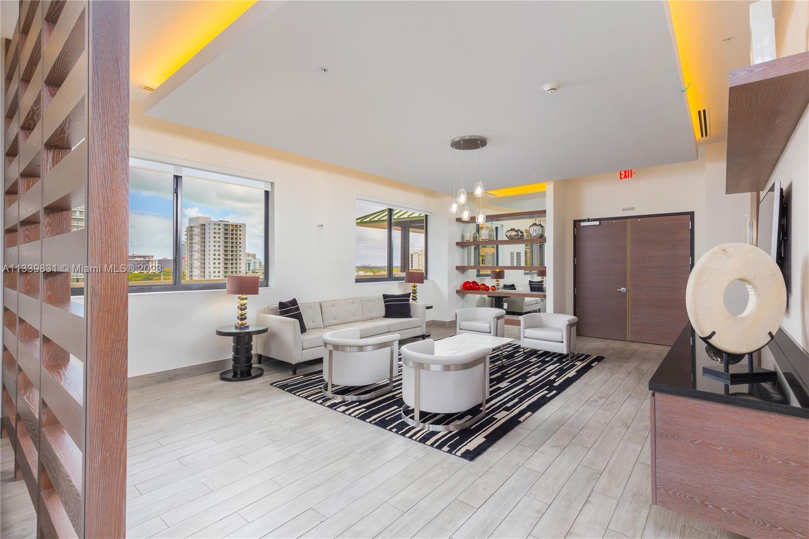 999 Southwest 1st Avenue, Unit 1811 Miami, FL 33130 - Photo 29 of 36 a living room with furniture and a fireplace