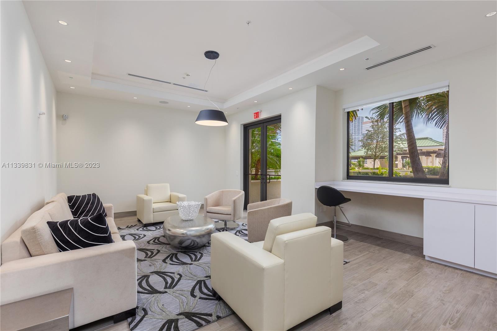 999 Southwest 1st Avenue, Unit 1811 Miami, FL 33130 - Photo 31 of 36 a living room with furniture and a large window