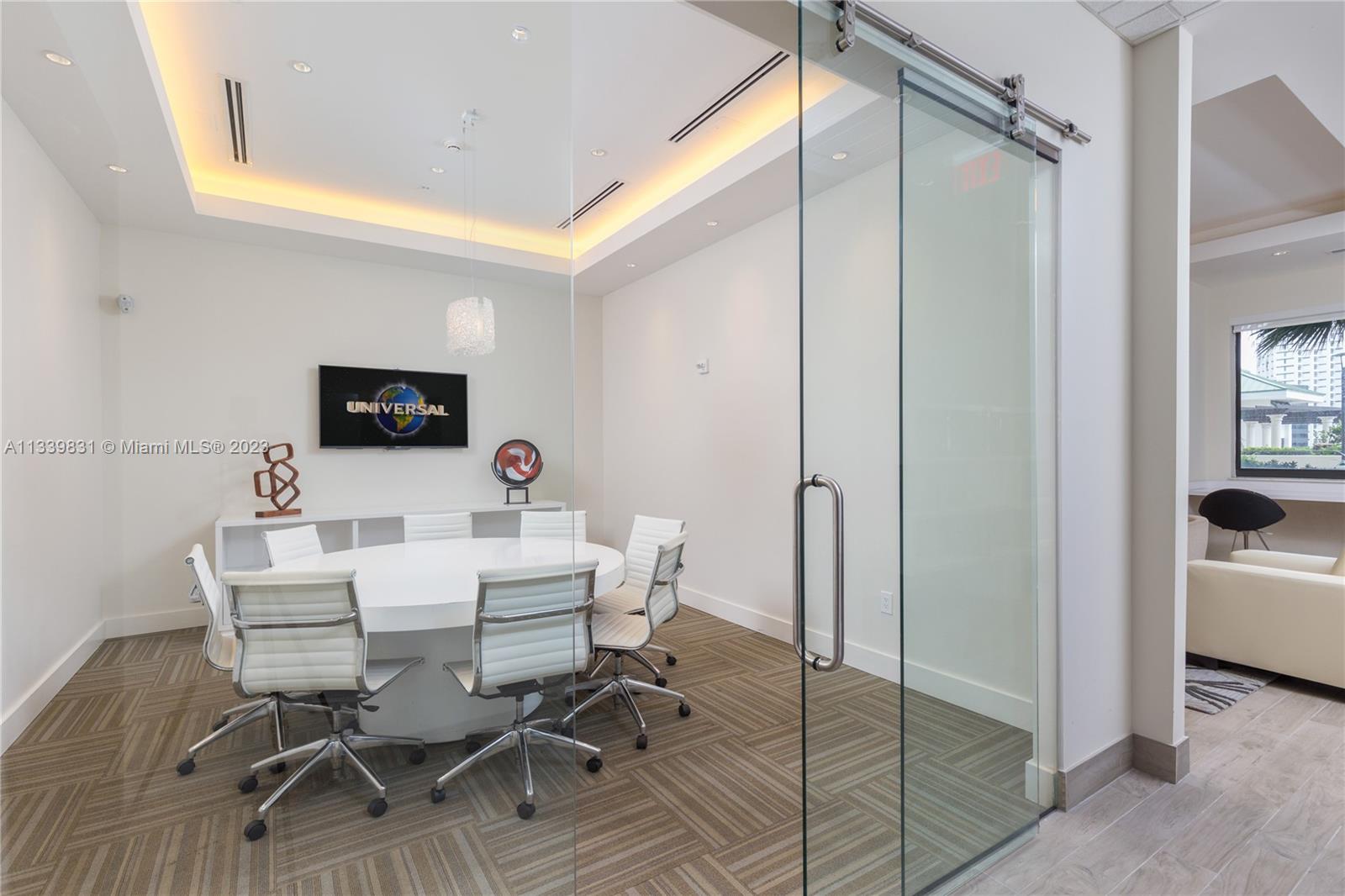 999 Southwest 1st Avenue, Unit 1811 Miami, FL 33130 - Photo 32 of 36 a view of a dining room with furniture