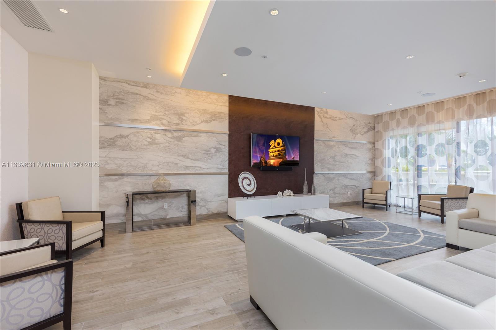 999 Southwest 1st Avenue, Unit 1811 Miami, FL 33130 - Photo 34 of 36 a living room with furniture and a fireplace