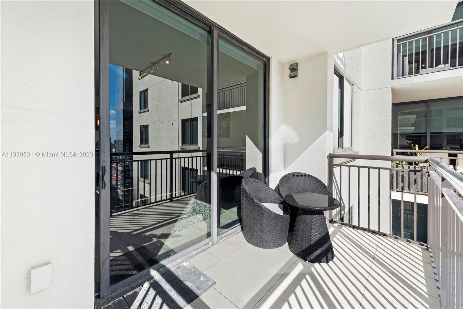 999 Southwest 1st Avenue, Unit 1811 Miami, FL 33130 - Photo 7 of 36 a view of balcony and wooden floor