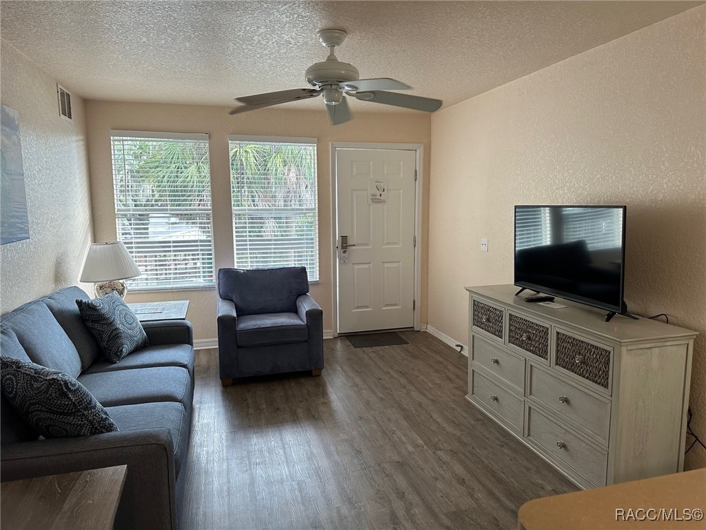5291 South Cherokee Way Homosassa, FL 34448 - Photo 10 of 27 a living room with furniture and a flat screen tv
