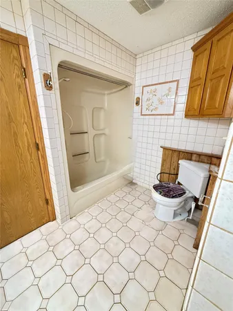 a bathroom with a sink a mirror and a bathtub