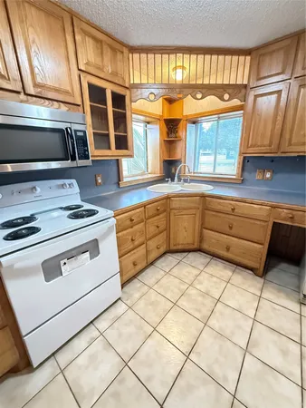 a kitchen with stainless steel appliances granite countertop a stove and a sink