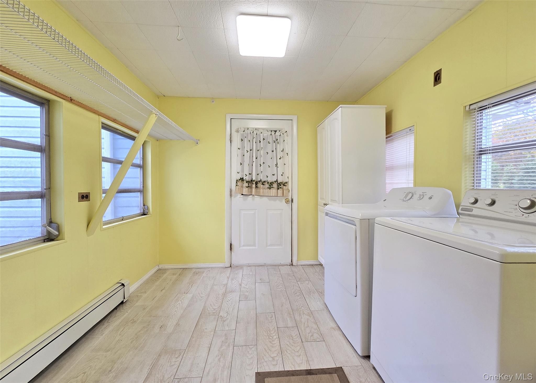 170 Forge Road Calverton, NY 11933 - Photo 12 of 23 a utility room with a washer and dryer