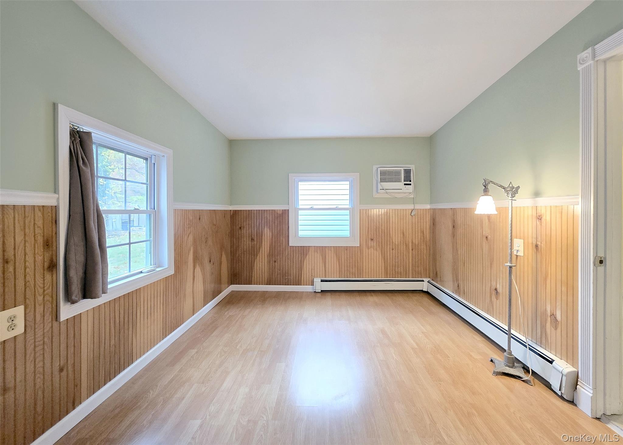 170 Forge Road Calverton, NY 11933 - Photo 13 of 23 wooden floor in an empty room with a window