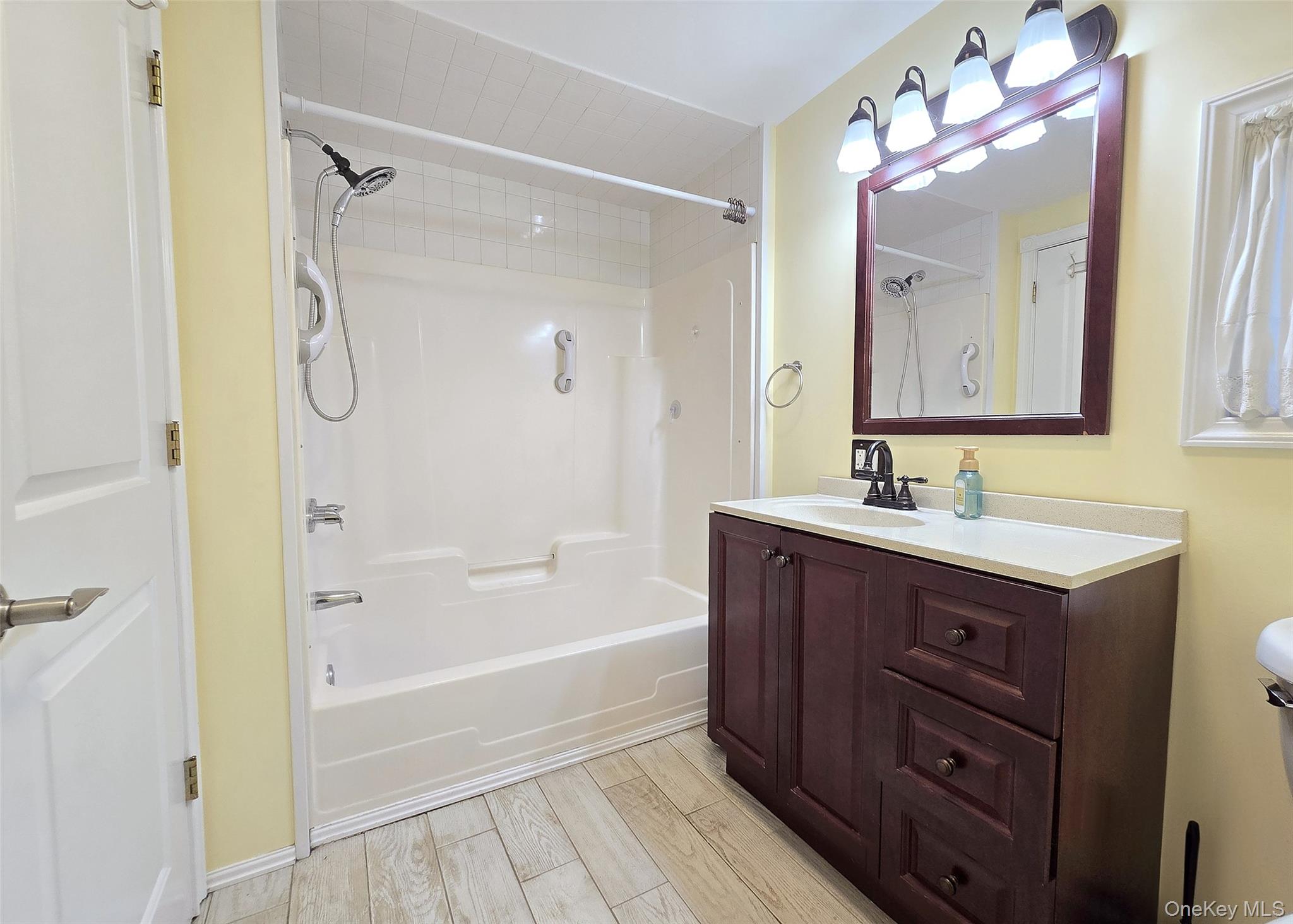 170 Forge Road Calverton, NY 11933 - Photo 17 of 23 a bathroom with a tub sink double vanity and shower