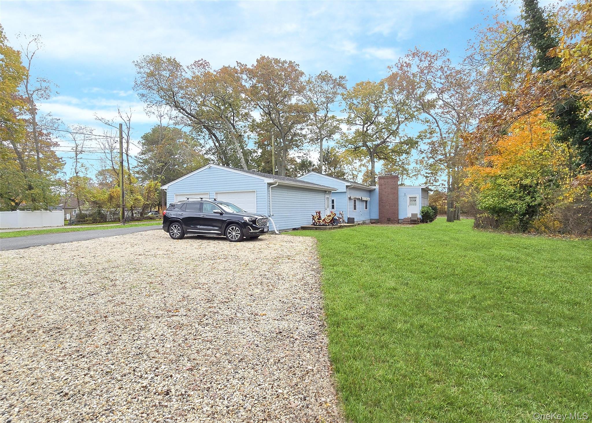 170 Forge Road Calverton, NY 11933 - Photo 20 of 23 a car parked in front of a house