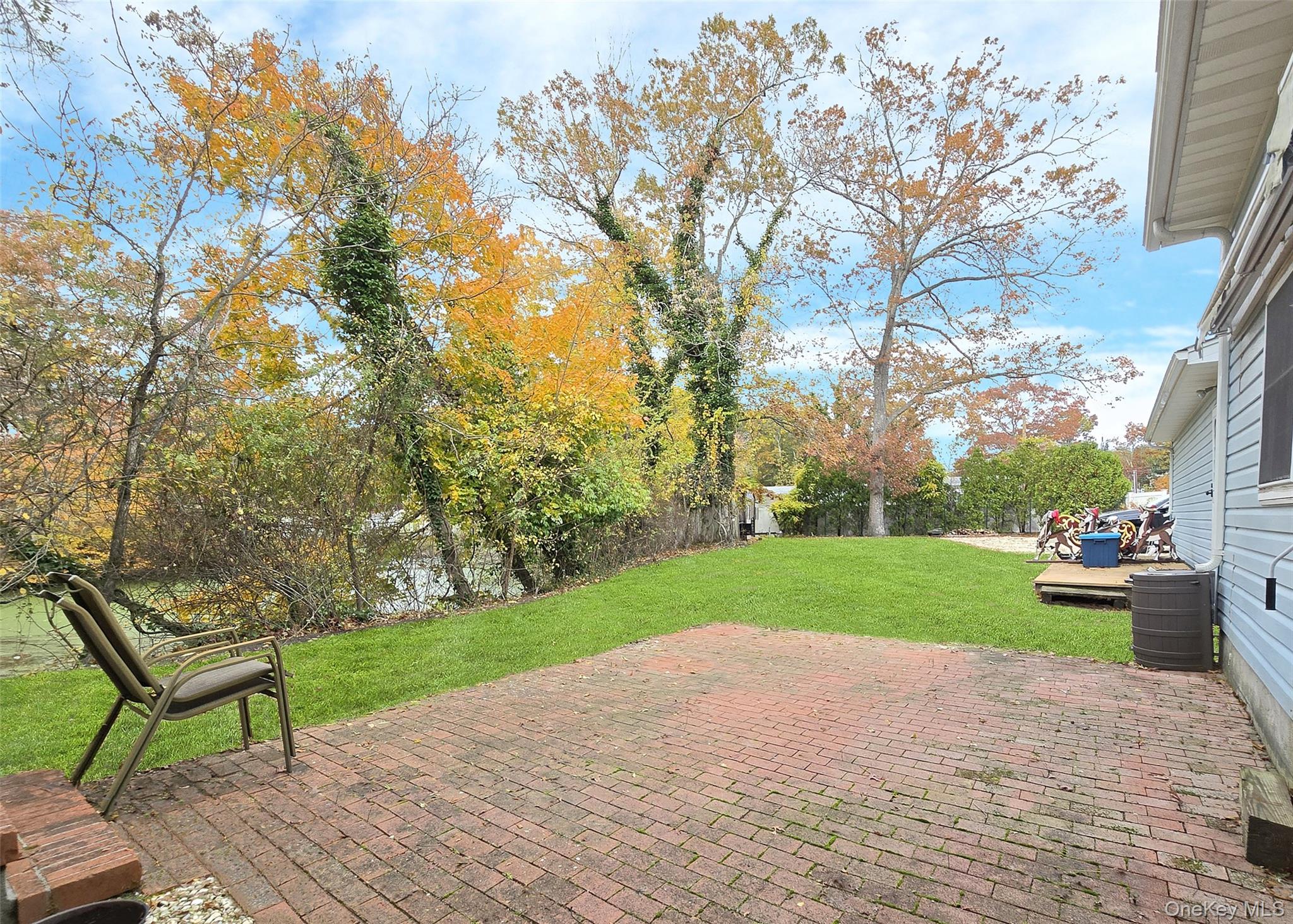 170 Forge Road Calverton, NY 11933 - Photo 21 of 23 a view of a garden with wooden fence