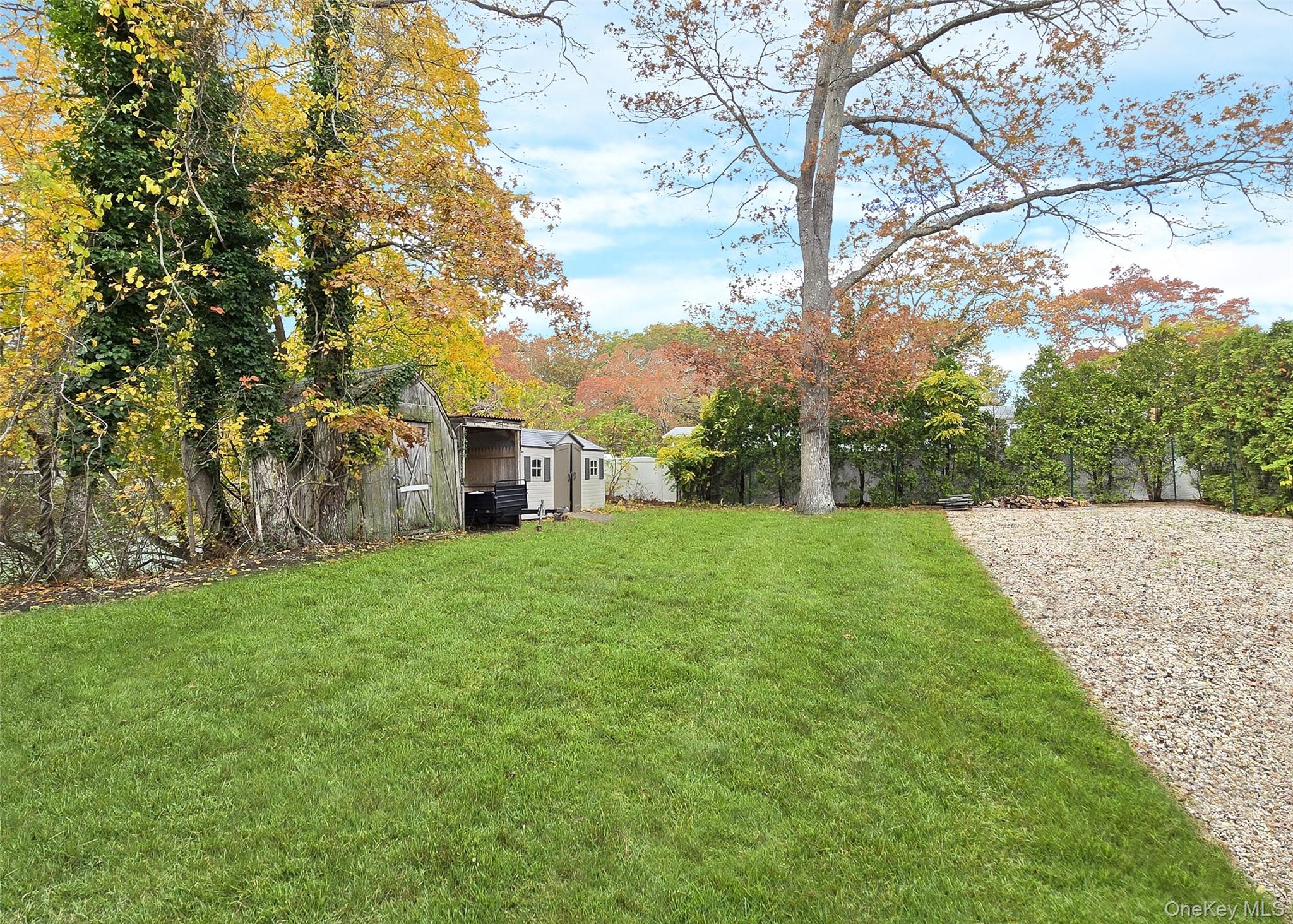 170 Forge Road Calverton, NY 11933 - Photo 22 of 23 a view of a house with yard and tree s