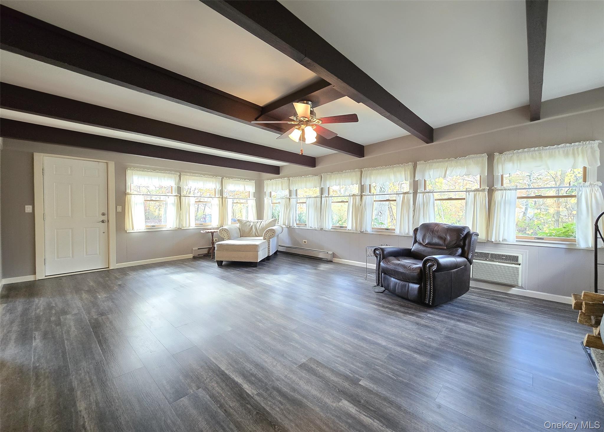 170 Forge Road Calverton, NY 11933 - Photo 4 of 23 a living room with furniture and a large window