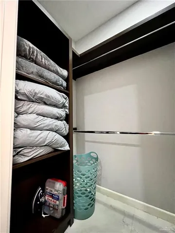 a living room with a bed and furniture