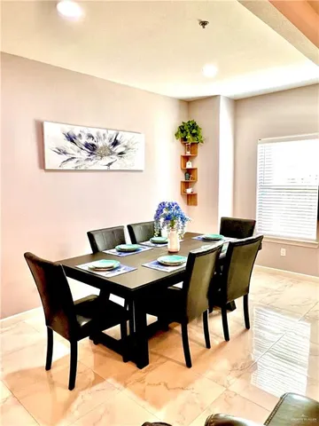 a view of a dining room with furniture