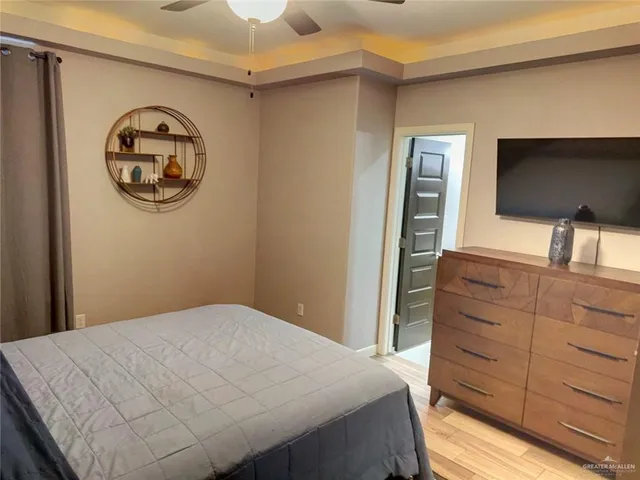 a bedroom with a bed and cabinets