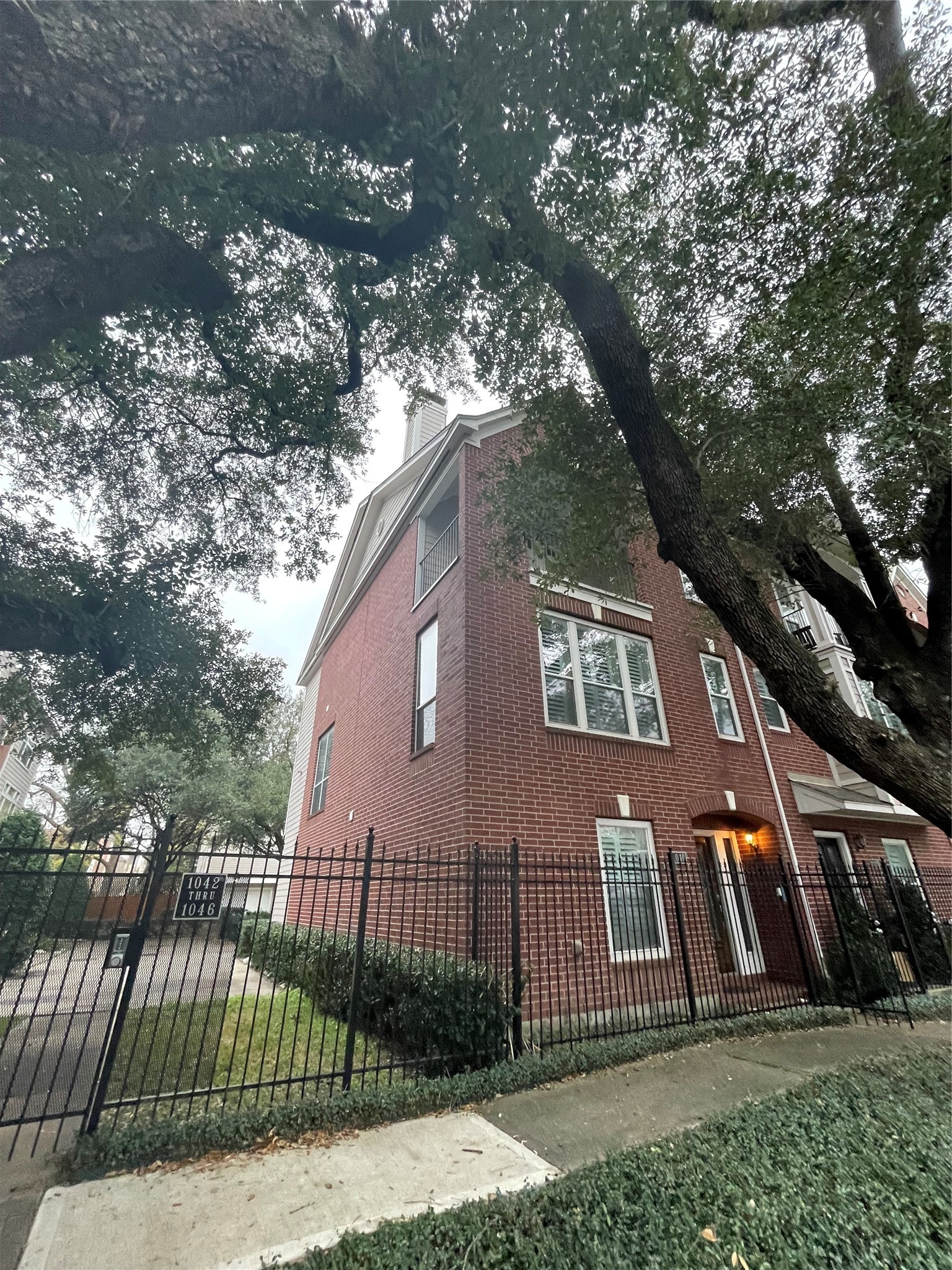 1040 La Rue Street Houston, TX 77019 - Photo 4 of 29 a view of a brick house with large windows