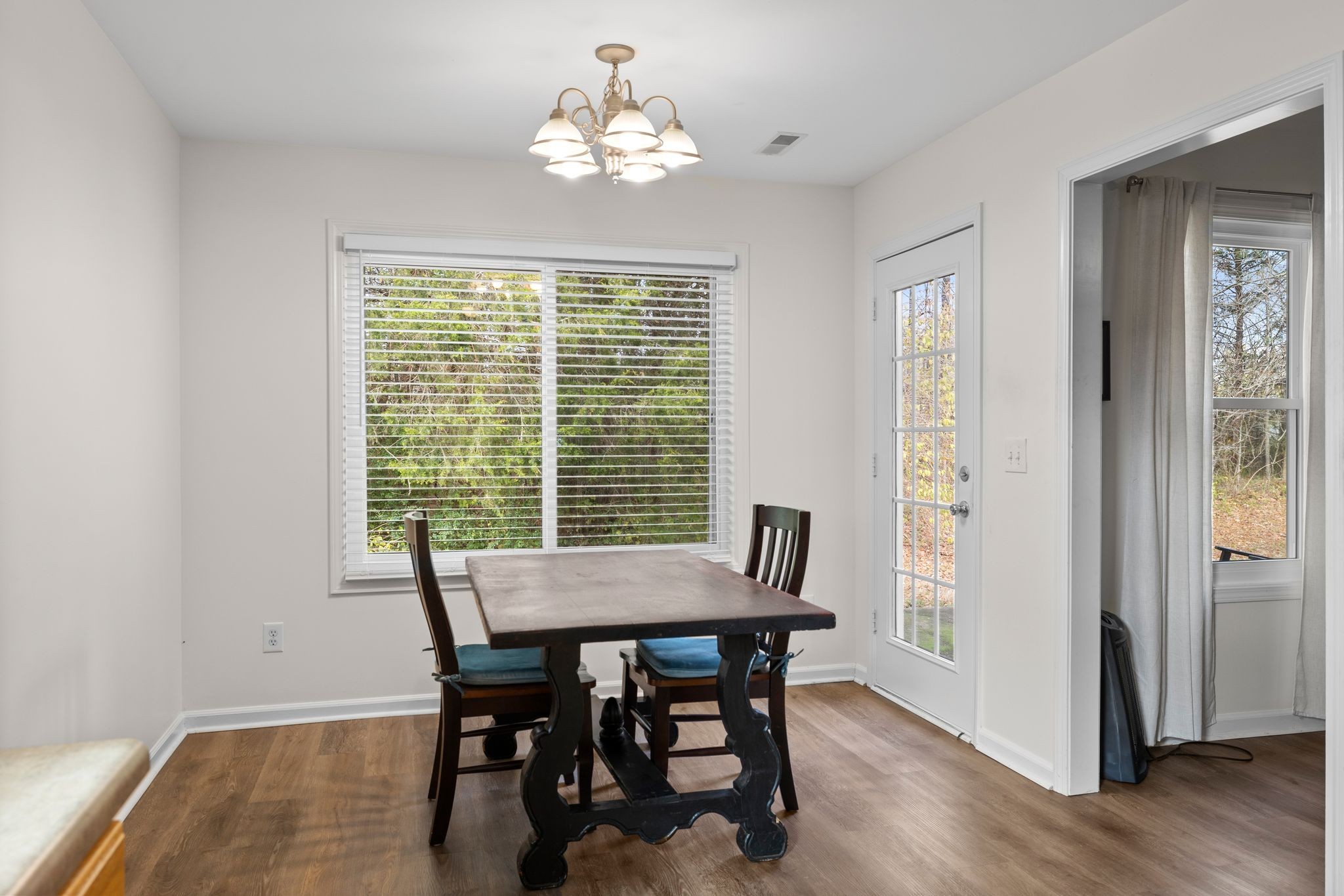2041 Golden Court Spring Hill, TN 37174 - Photo 12 of 20 a view of a dining room with furniture window and wooden floor